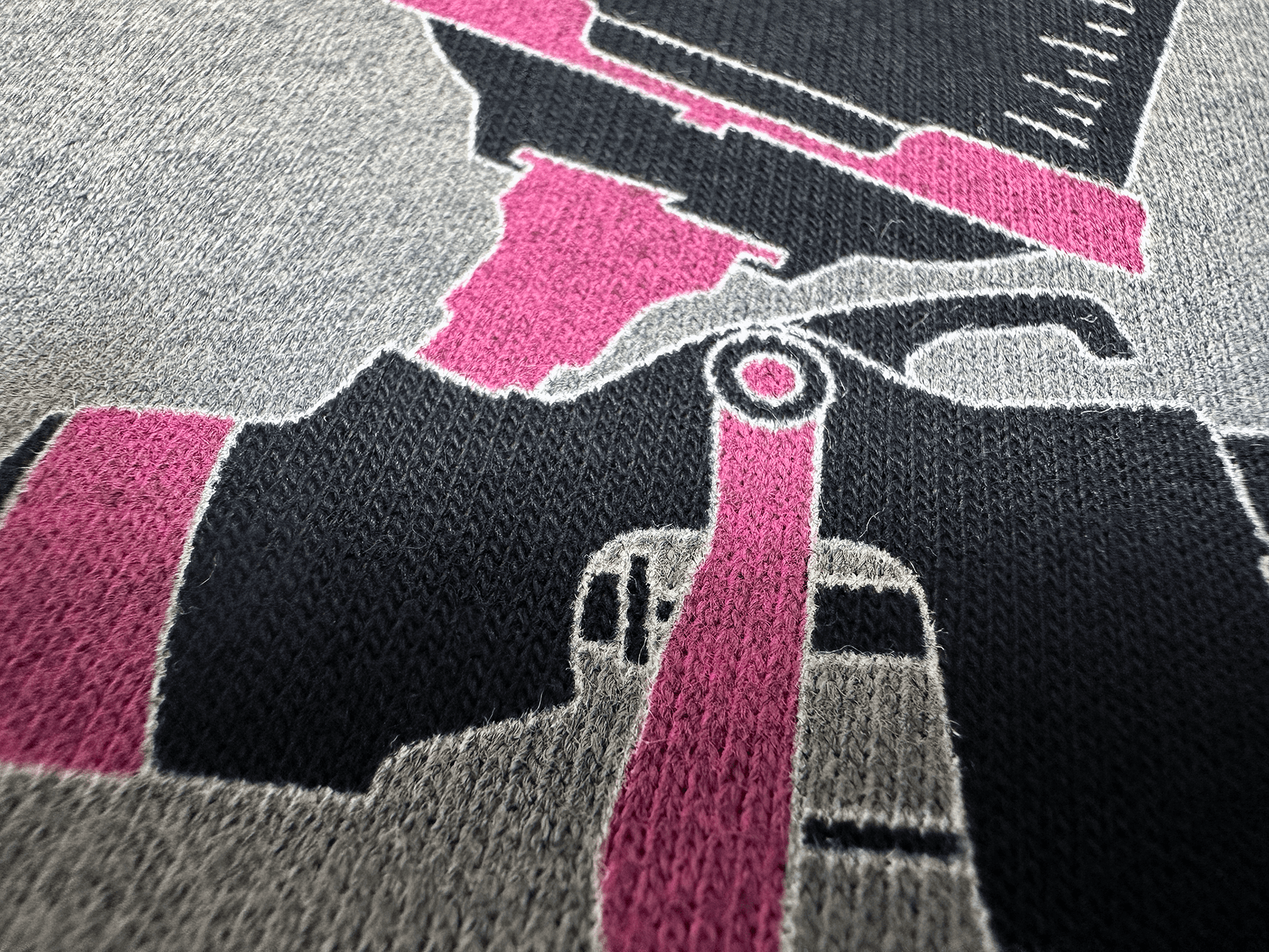 Pink and Black PSA Logo on Black Hoodie Close Up Tilted Up and Right Angle View of Paint Gun