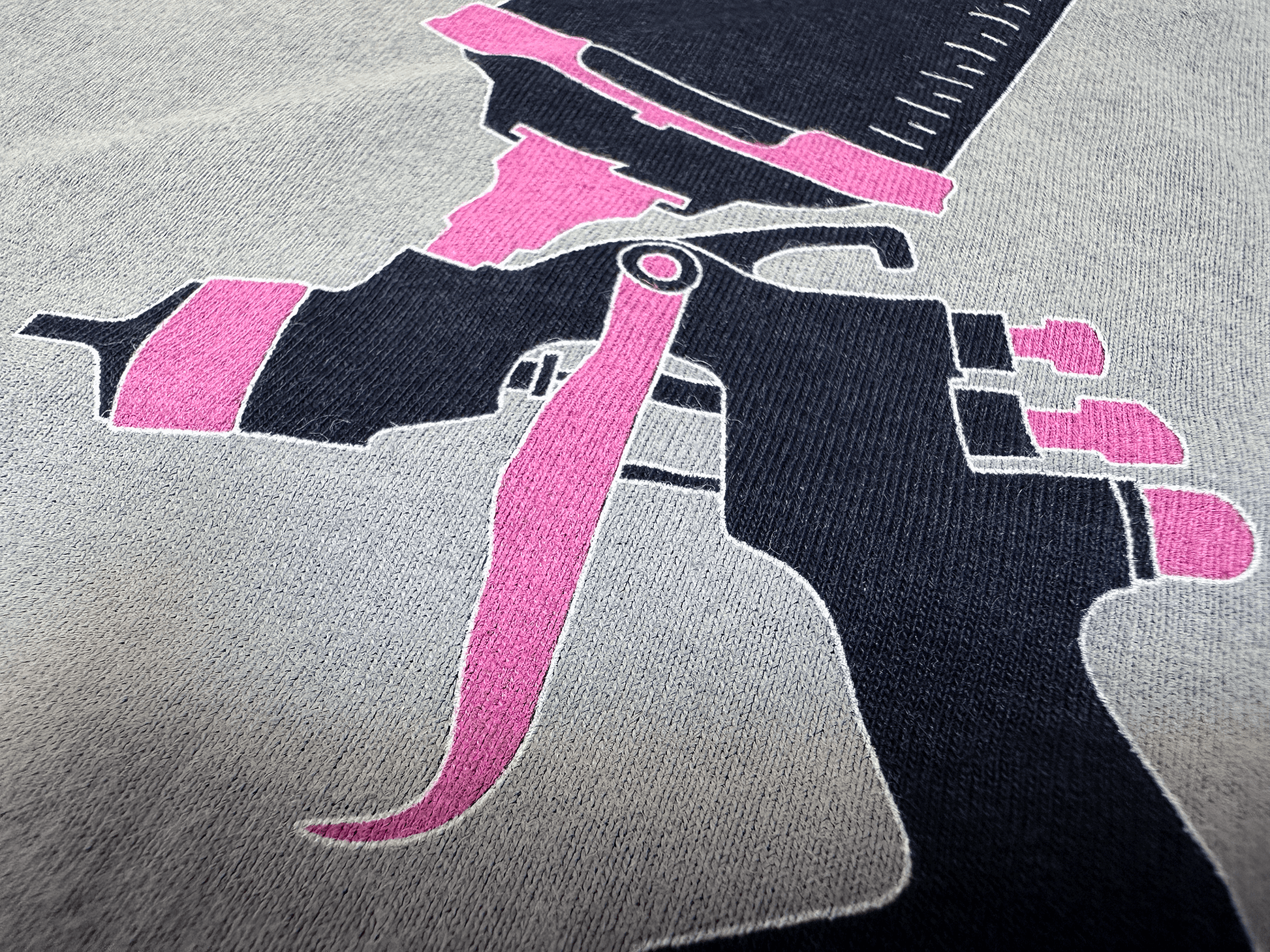 Pink and Black PSA Logo on Ladies' Black Tank Top Close Up Tilted Up and Right Angle View of Paint Gun